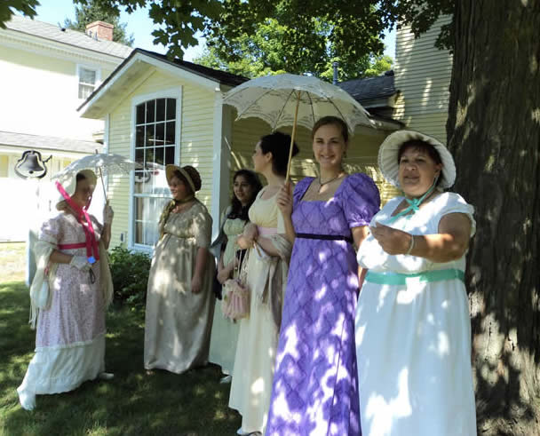 ladies in Regency costume watch the activities at a Jane Austen weekend