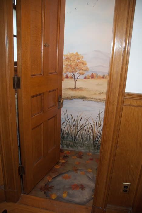 Trompe-l'oeil bathroom with Vermont fall foliage at Governor's House in Hyde Park. Photo by www.orahmoore.net.