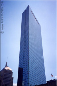 Glass skyscraper against a blue sky