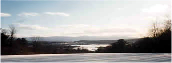 winter photo of Vermont bed and breakfast adjoining VAST snowmobile trail near Stowe, Vermont