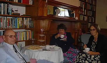 photo of Carroll Page having tea with some family members at The Governor's House, a bed and breakfast in Hyde Park, Vermont