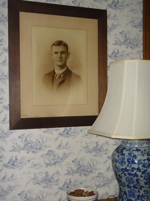 Large framed photo of one of the Page boys who grew up in this in bedroom in Hyde Park
