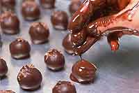 photo of dipping chocolates by hand at Laughing Moon, Stowe, VT