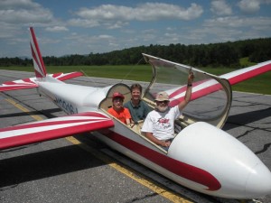 passengers smie from their seats after a glider ride