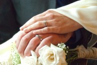 hands with wedding rings of newly-married couple