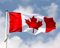 Canadian flag agaoinsty the sky